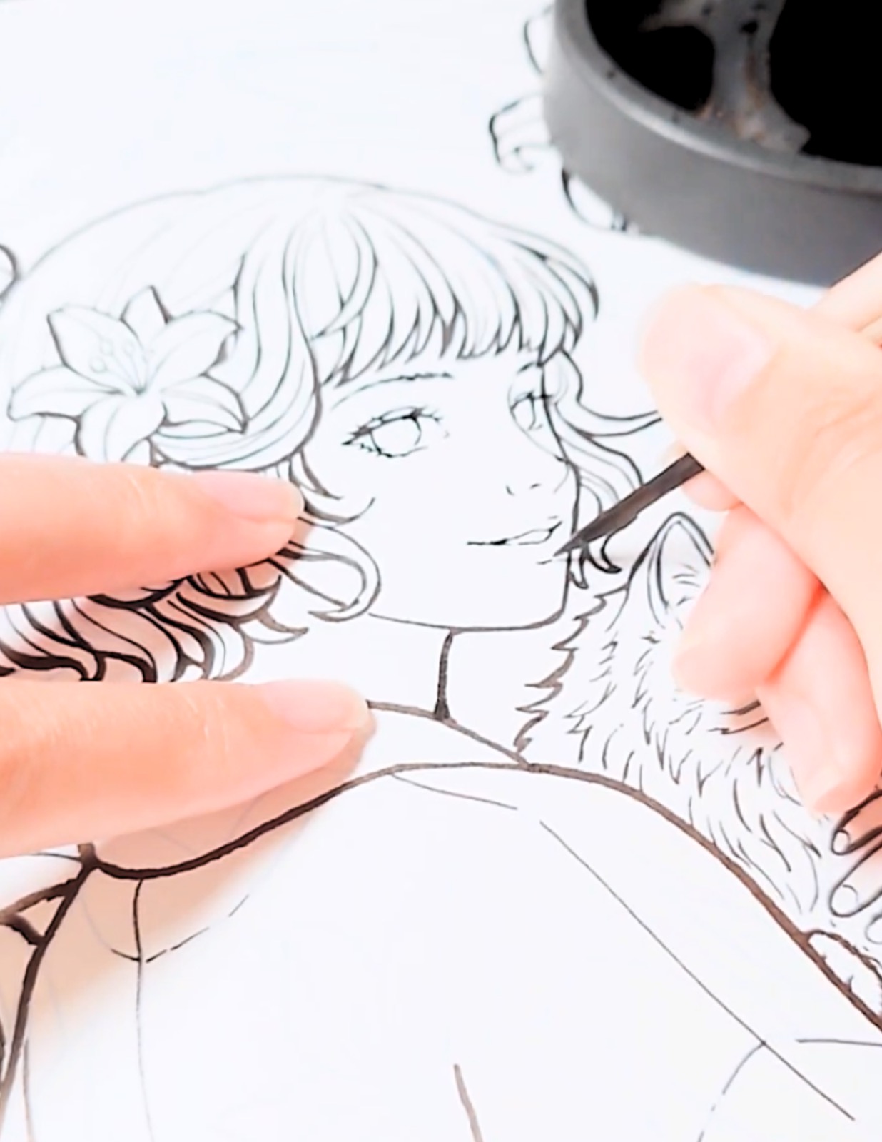 Drawing the Cat Maiden's face by hand with a wooden toothpick and Sumi ink