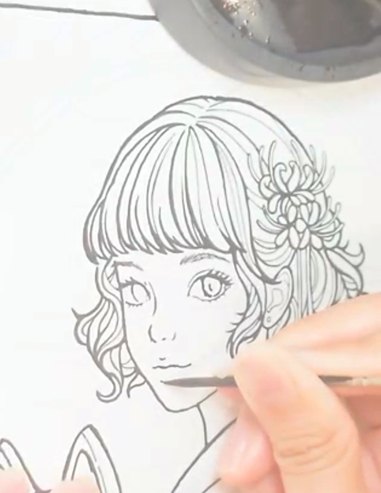 Drawing a maiden's face by hand with a wooden toothpick and Sumi ink